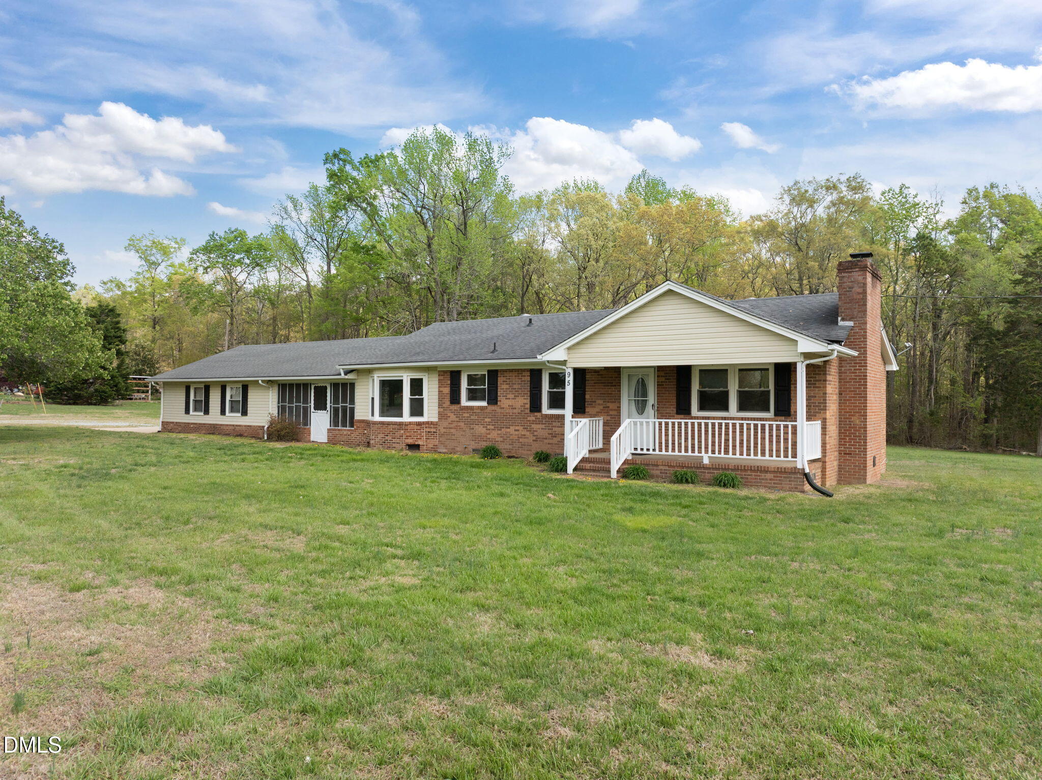 95 Harold Gill Road Roxboro, NC 27574 - Photo 51 of 53 a front view of a house with a garden