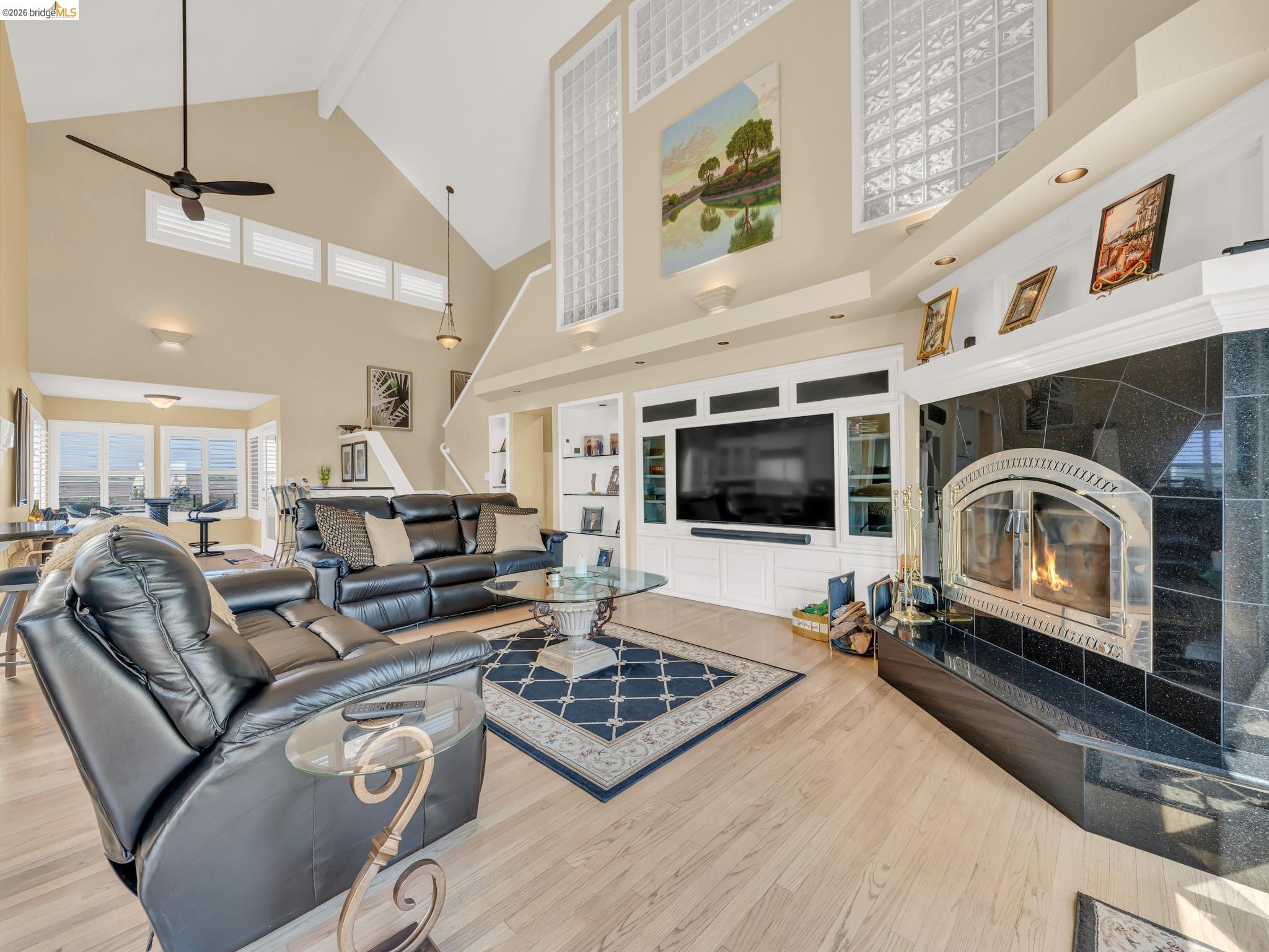 17035 Terminous Road Isleton, CA 95641 - Photo 22 of 48 Living area with light wood finished floors, a fireplace, and a ceiling fan