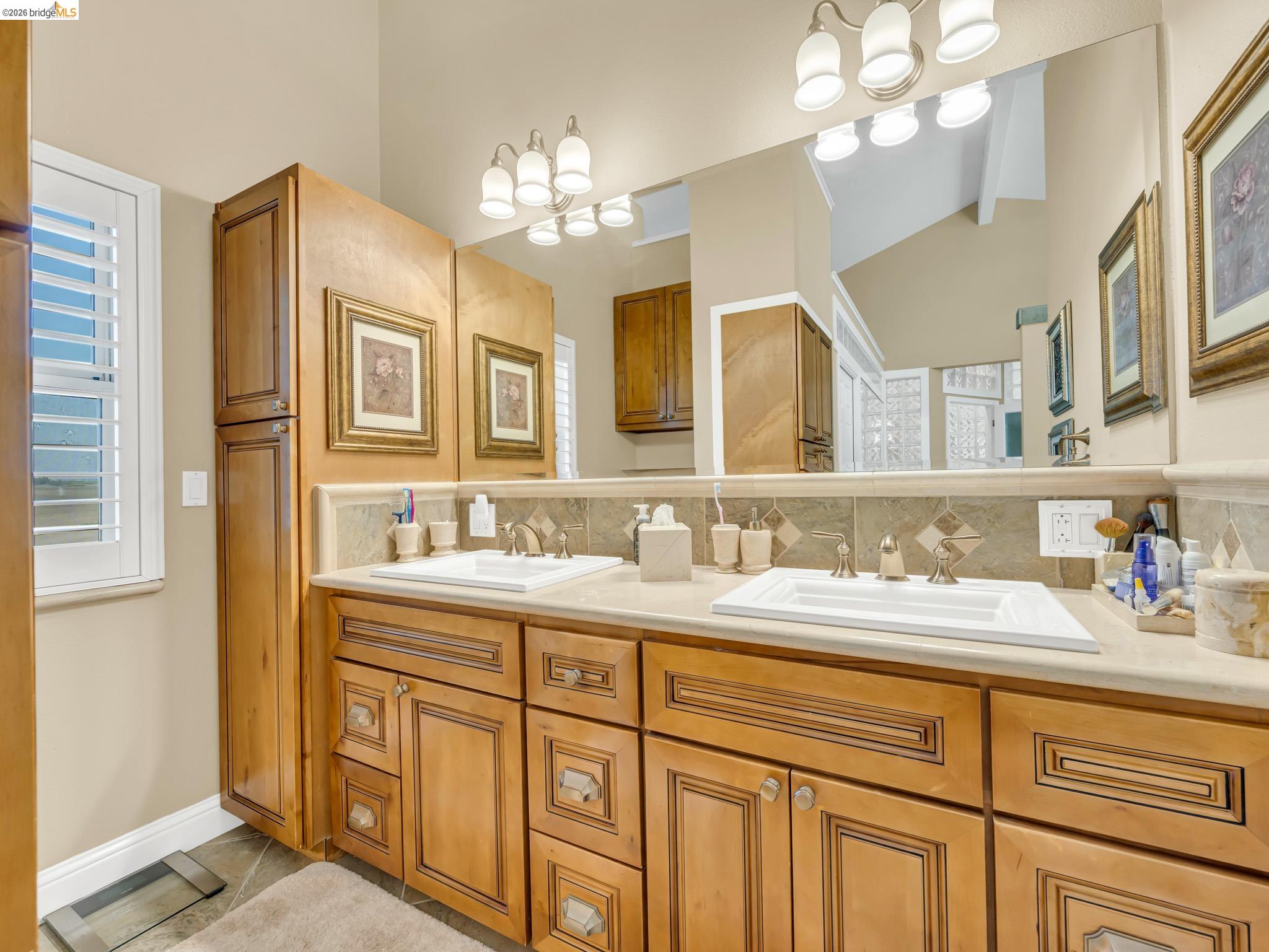 17035 Terminous Road Isleton, CA 95641 - Photo 30 of 48 Bathroom with double vanity, backsplash, a chandelier, and light tile patterned floors