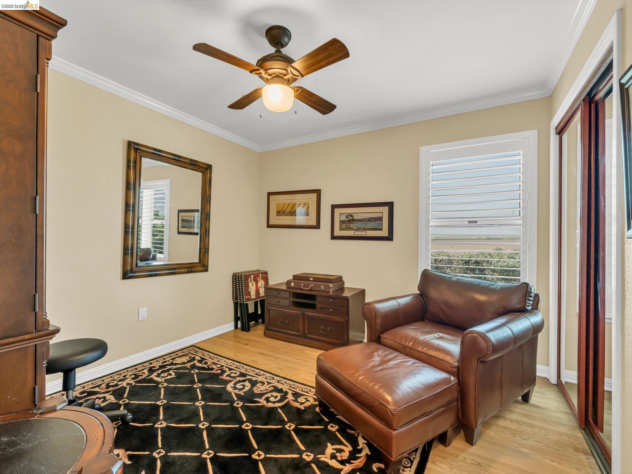 17035 Terminous Road Isleton, CA 95641 - Photo 35 of 48 Living area with light wood finished floors, ornamental molding, and ceiling fan