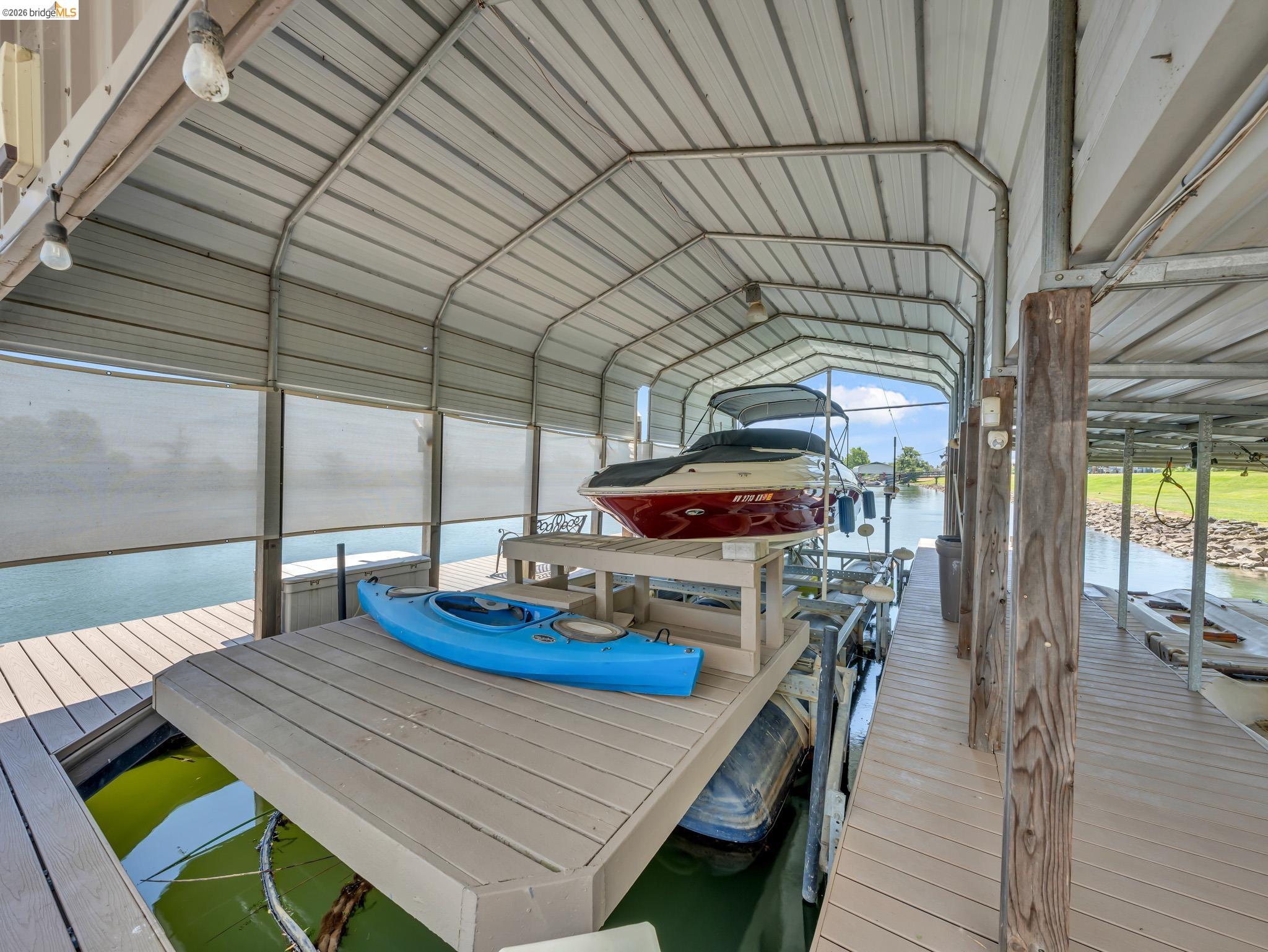 17035 Terminous Road Isleton, CA 95641 - Photo 4 of 48 Dock featuring boat lift and a water view