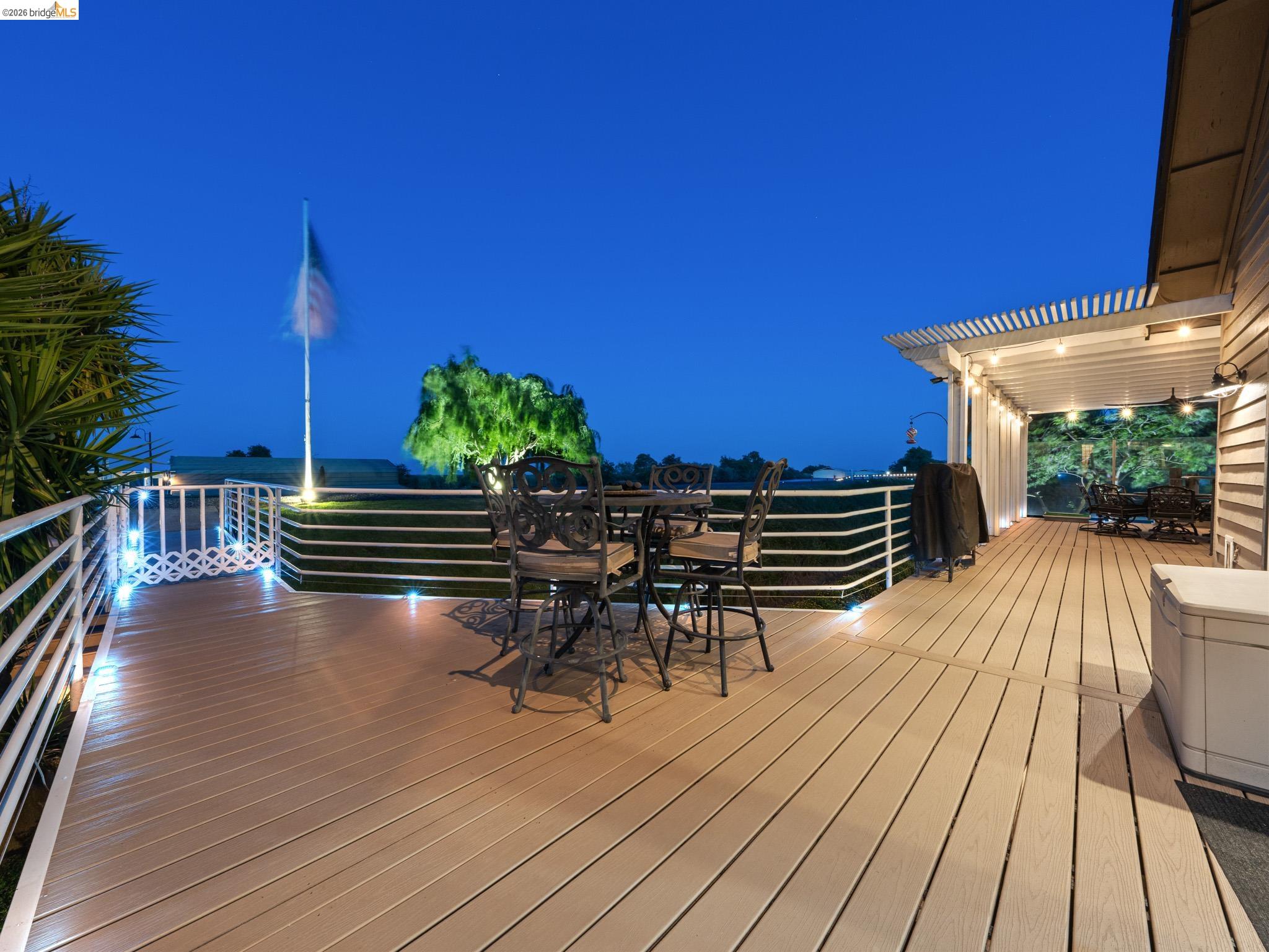 17035 Terminous Road Isleton, CA 95641 - Photo 42 of 48 Deck at night featuring outdoor dining area