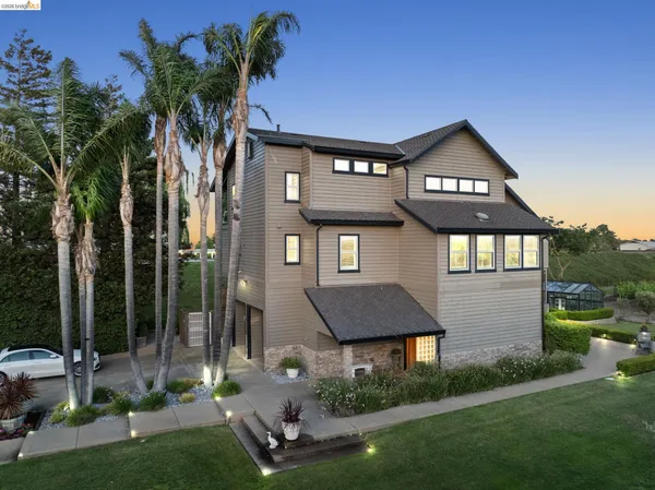 a front view of a house with a yard