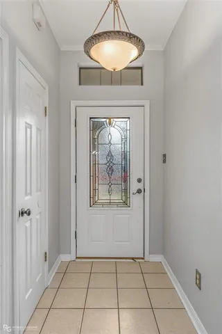 a view of an entryway with a chandelier fan