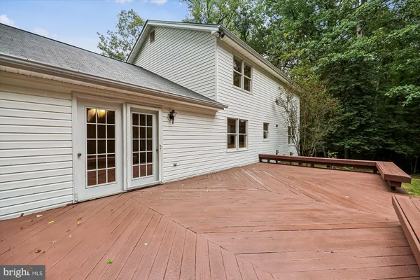 a view of a white house with a outdoor space