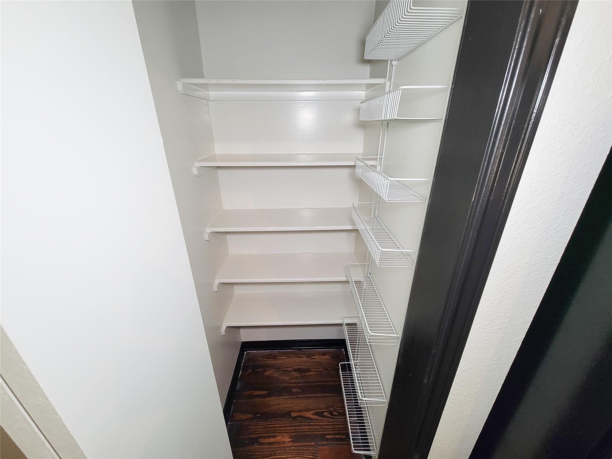 1904 Davis Street Houston, TX 77026 - Photo 15 of 33 a view of walk in closet with empty racks