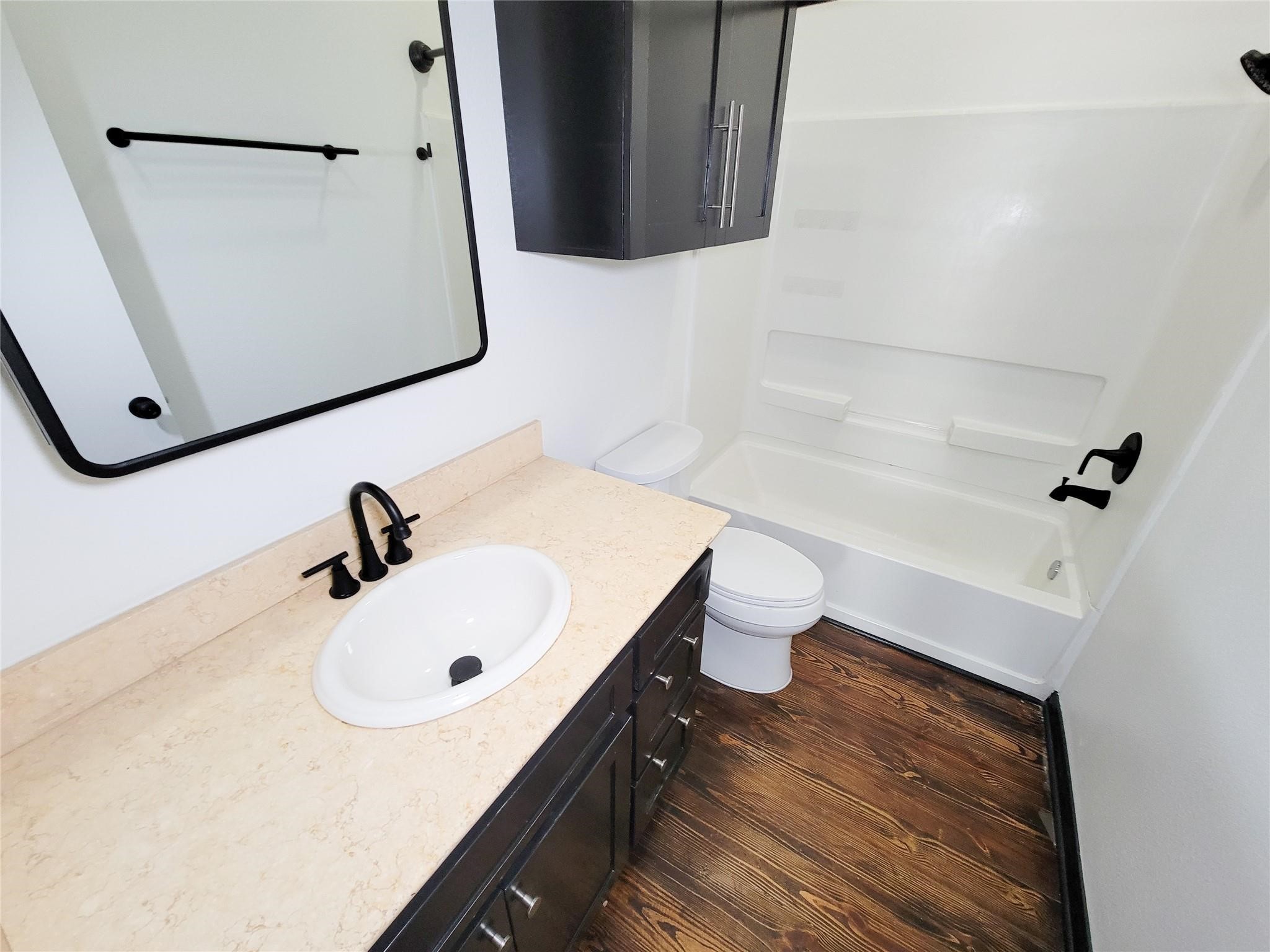 1904 Davis Street Houston, TX 77026 - Photo 21 of 33 a bathroom with a sink toilet and tub