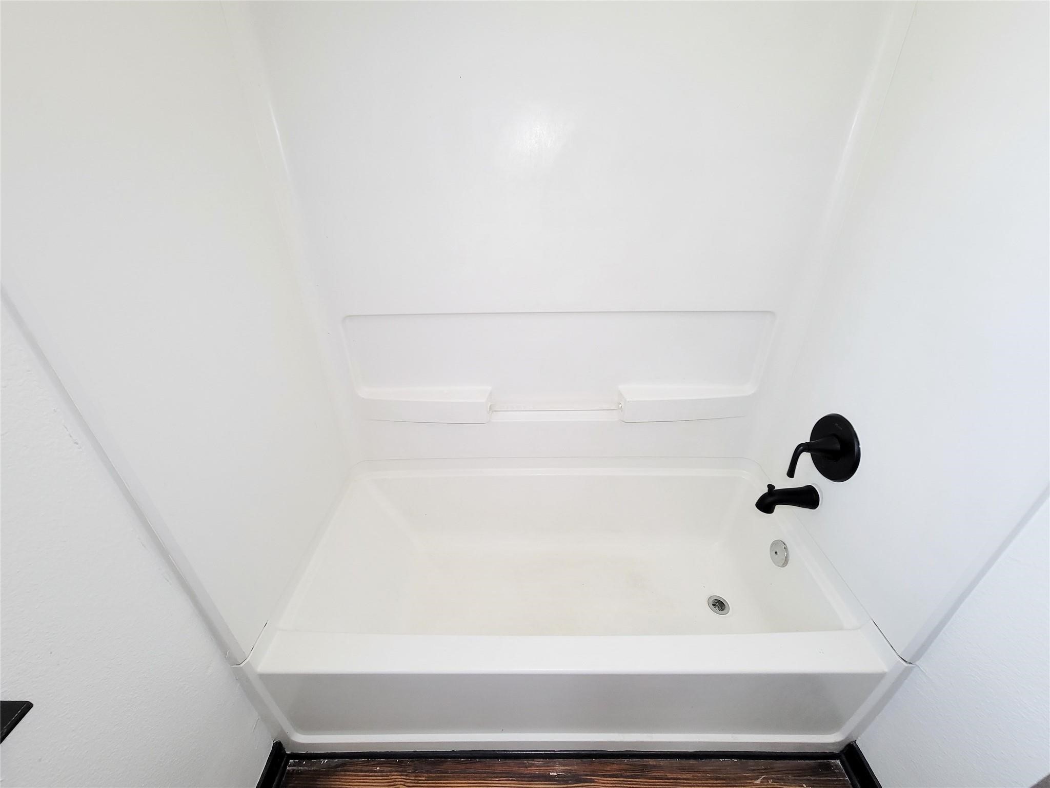 1904 Davis Street Houston, TX 77026 - Photo 29 of 33 a bathroom with a bathtub