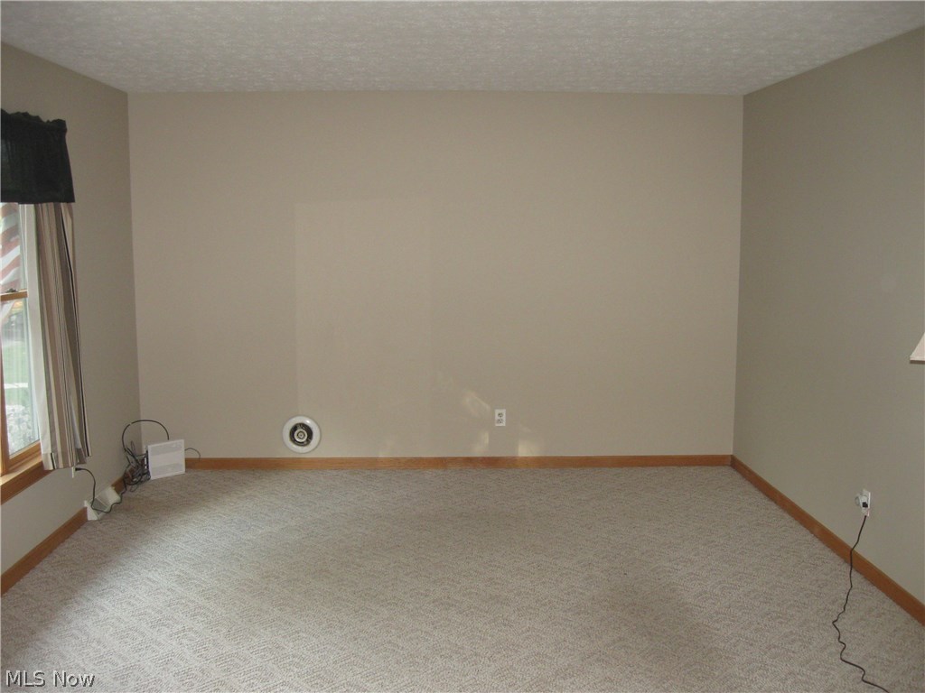 9020 Diagonal Road Streetsboro, OH 44241 - Photo 4 of 26 Living room has been freshly painted in a neutral tone. Lots of natural light fills the room.