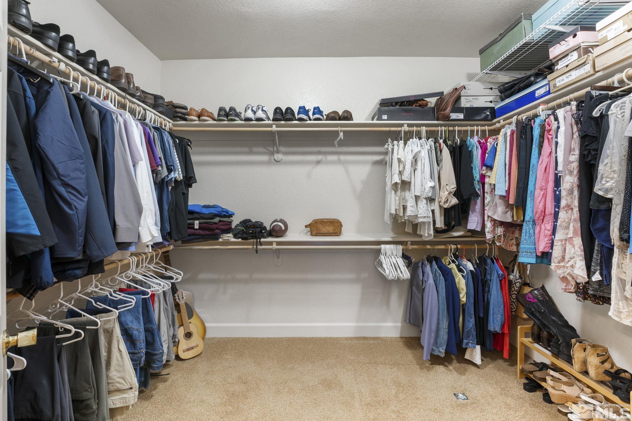 8150 Willow Ranch Trail Reno, NV 89523 - Photo 17 of 32 a view of walk in closet with clothes and shoes