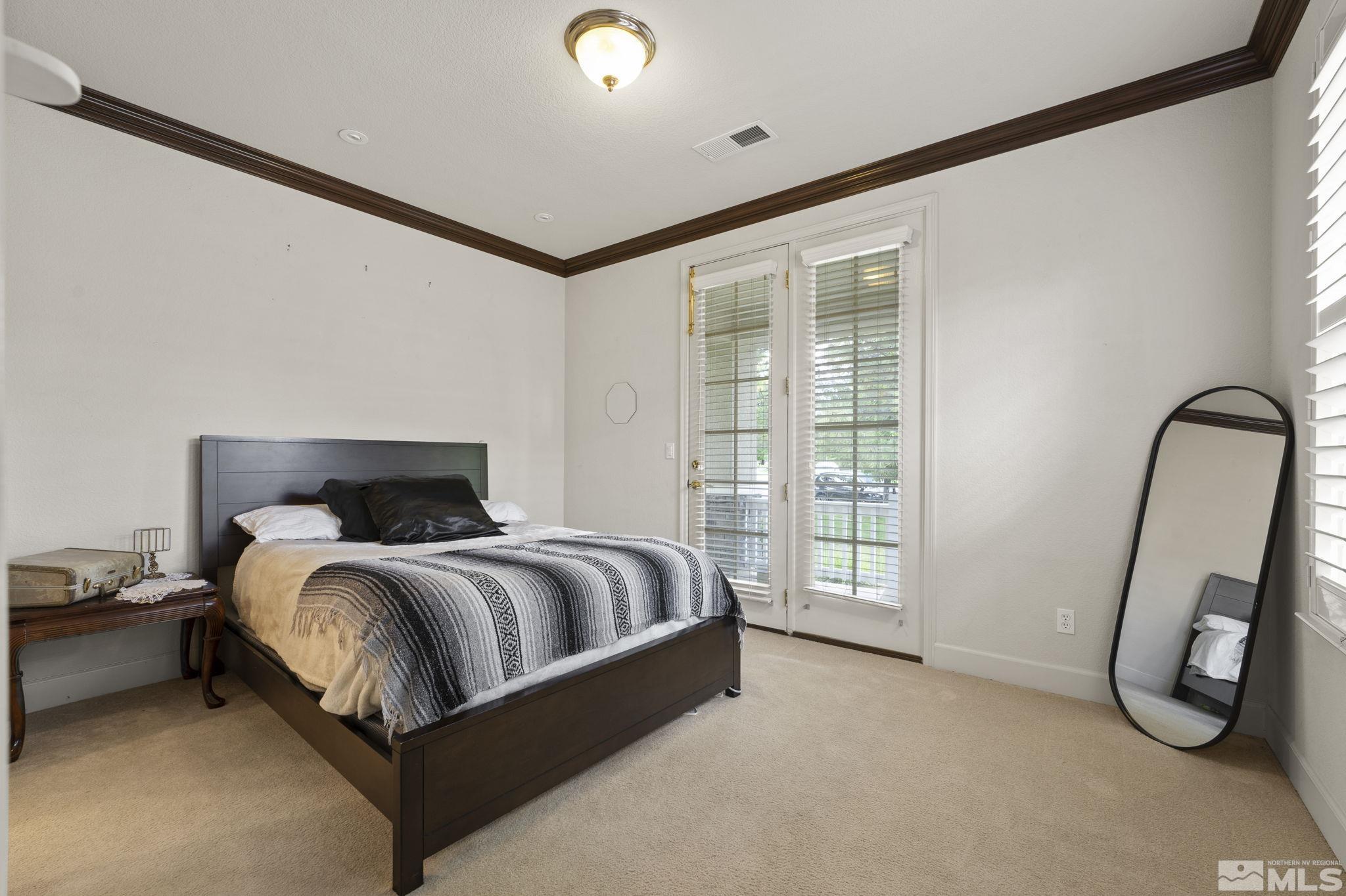 8150 Willow Ranch Trail Reno, NV 89523 - Photo 18 of 32 a bed room with a bed and a chair