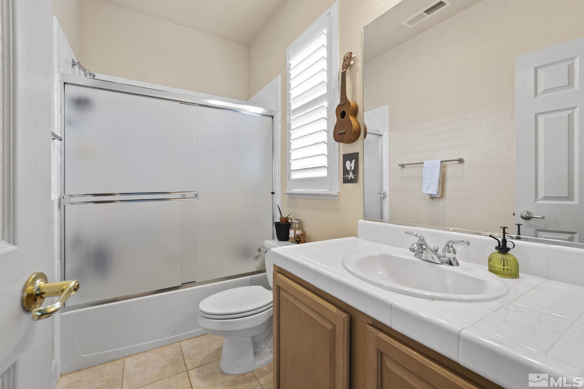 8150 Willow Ranch Trail Reno, NV 89523 - Photo 19 of 32 a bathroom with a sink toilet and shower