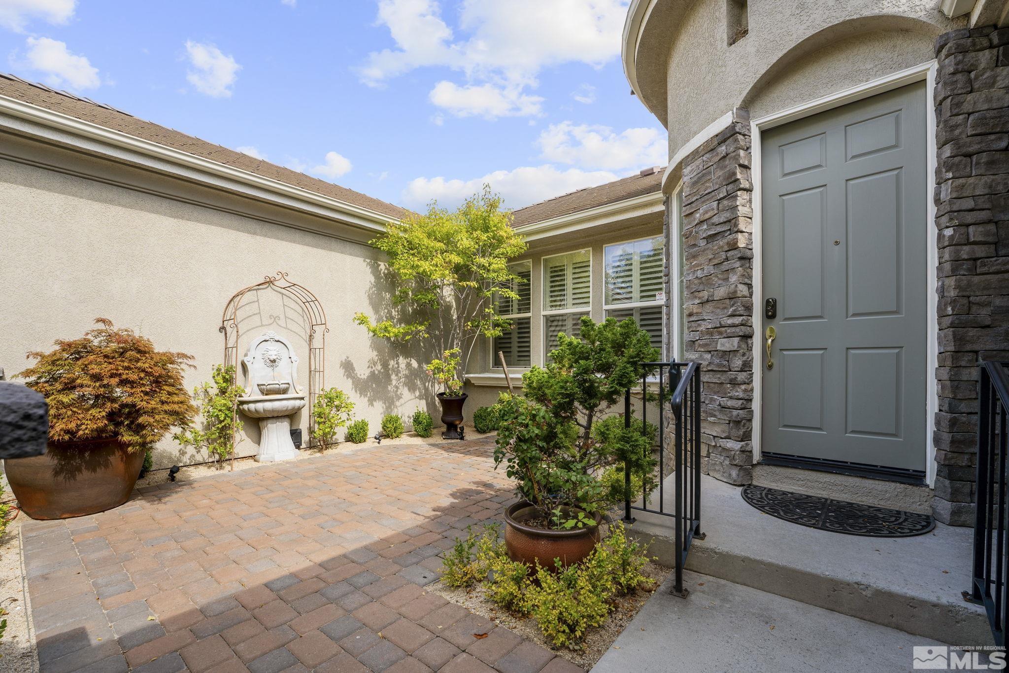 8150 Willow Ranch Trail Reno, NV 89523 - Photo 2 of 32 a large parking space with potted plants