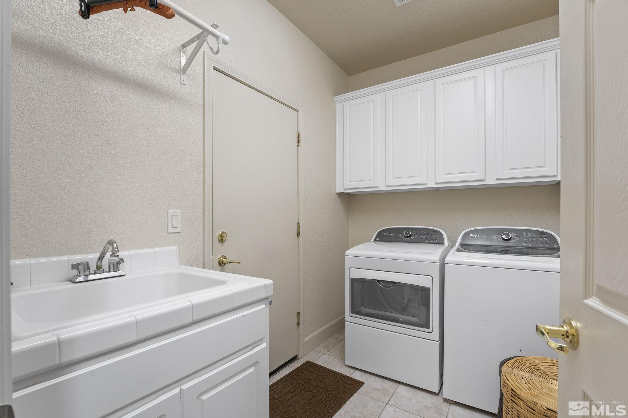 8150 Willow Ranch Trail Reno, NV 89523 - Photo 23 of 32 a utility room with dryer and washer