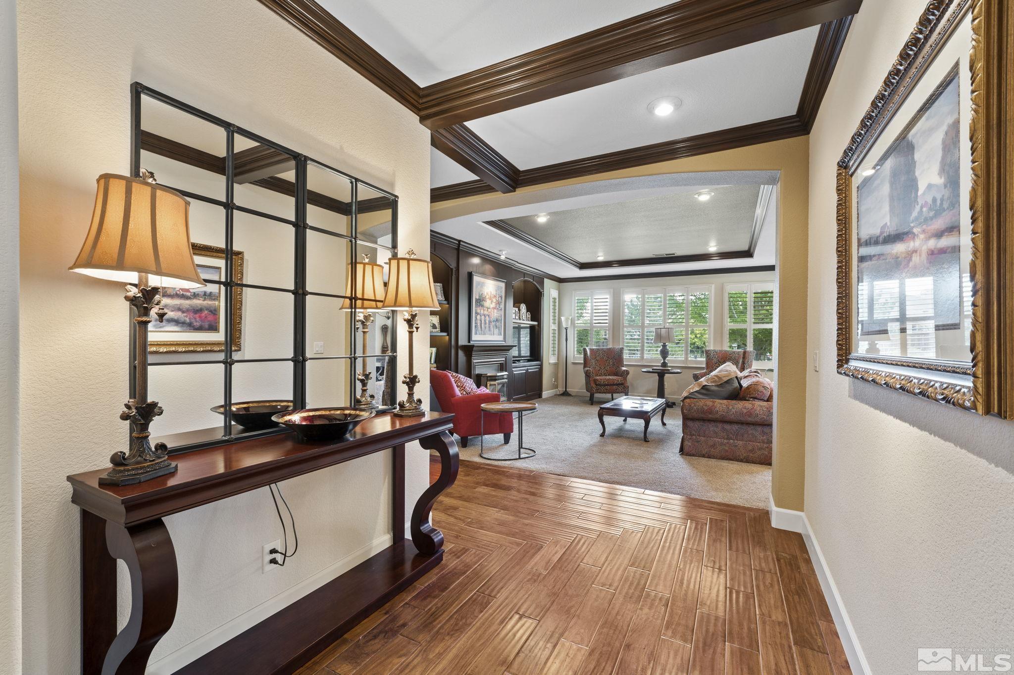 8150 Willow Ranch Trail Reno, NV 89523 - Photo 4 of 32 a living room with furniture a large window and wooden floor