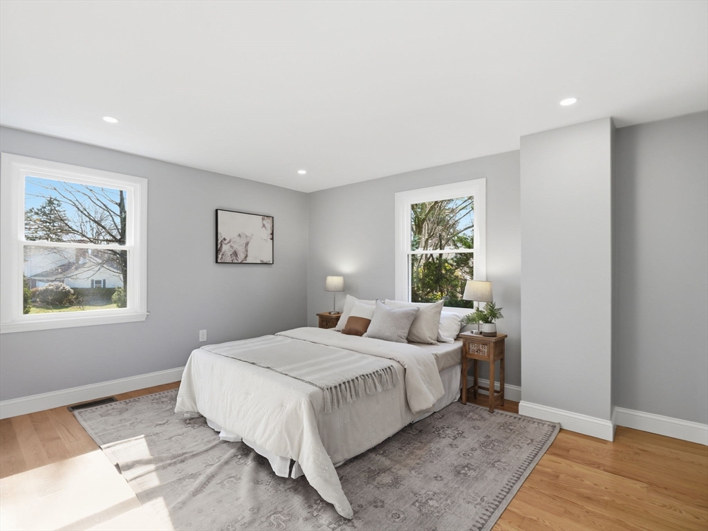 58 Maple Street Framingham, MA 01702 - Photo 12 of 35 a bedroom with a large bed and a window