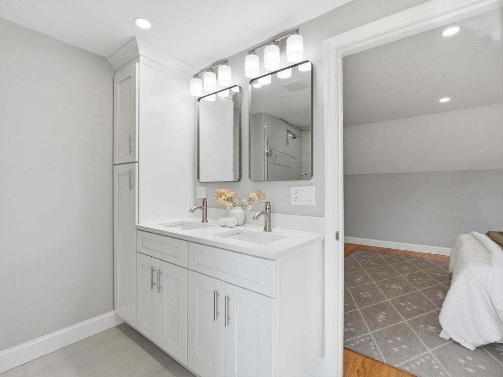 58 Maple Street Framingham, MA 01702 - Photo 17 of 35 a bathroom with a sink and a mirror