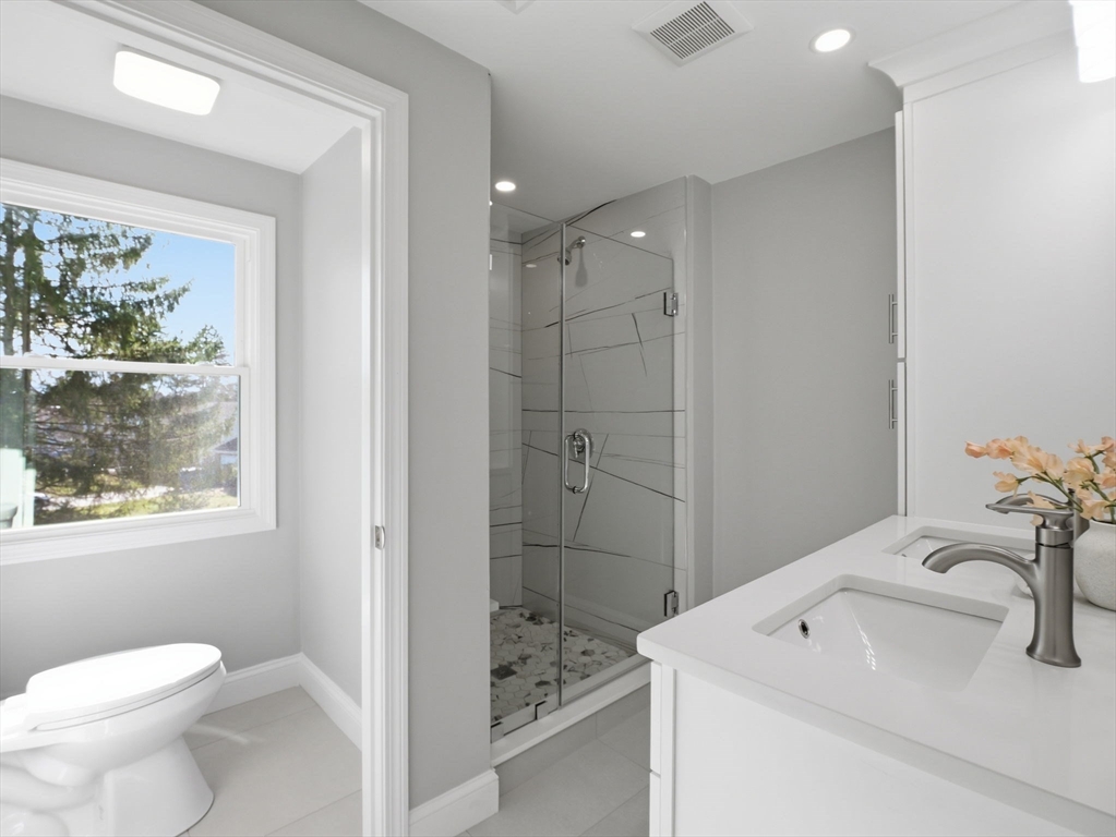 58 Maple Street Framingham, MA 01702 - Photo 18 of 35 a bathroom with a sink toilet and shower