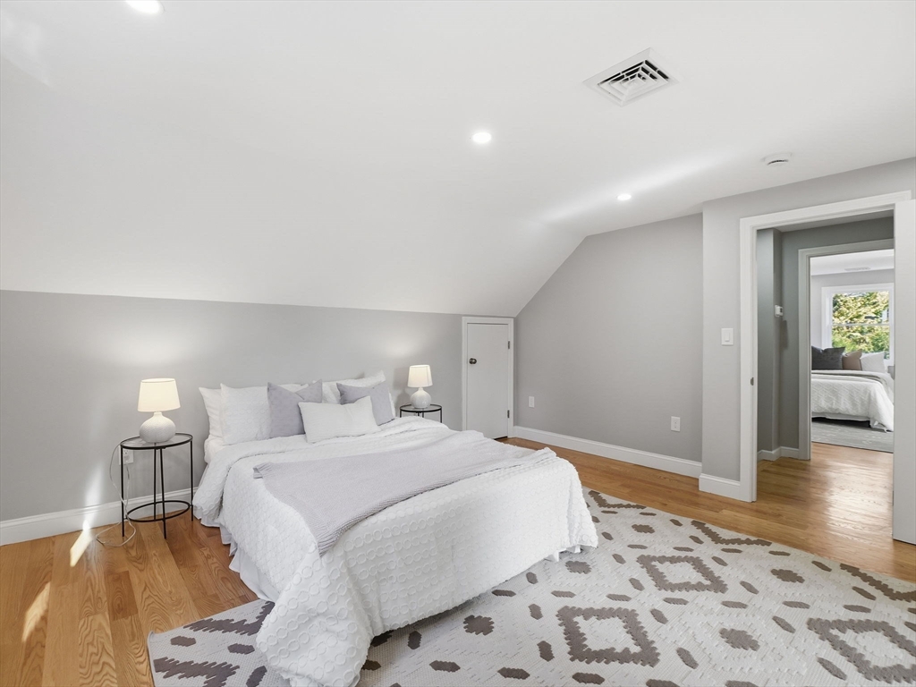 58 Maple Street Framingham, MA 01702 - Photo 19 of 35 a bedroom with a bed and a view of bathroom