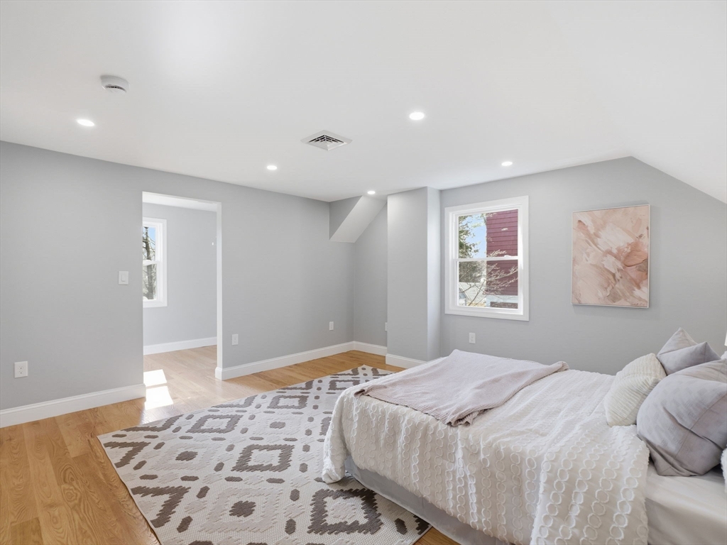 58 Maple Street Framingham, MA 01702 - Photo 20 of 35 a bedroom with a large bed