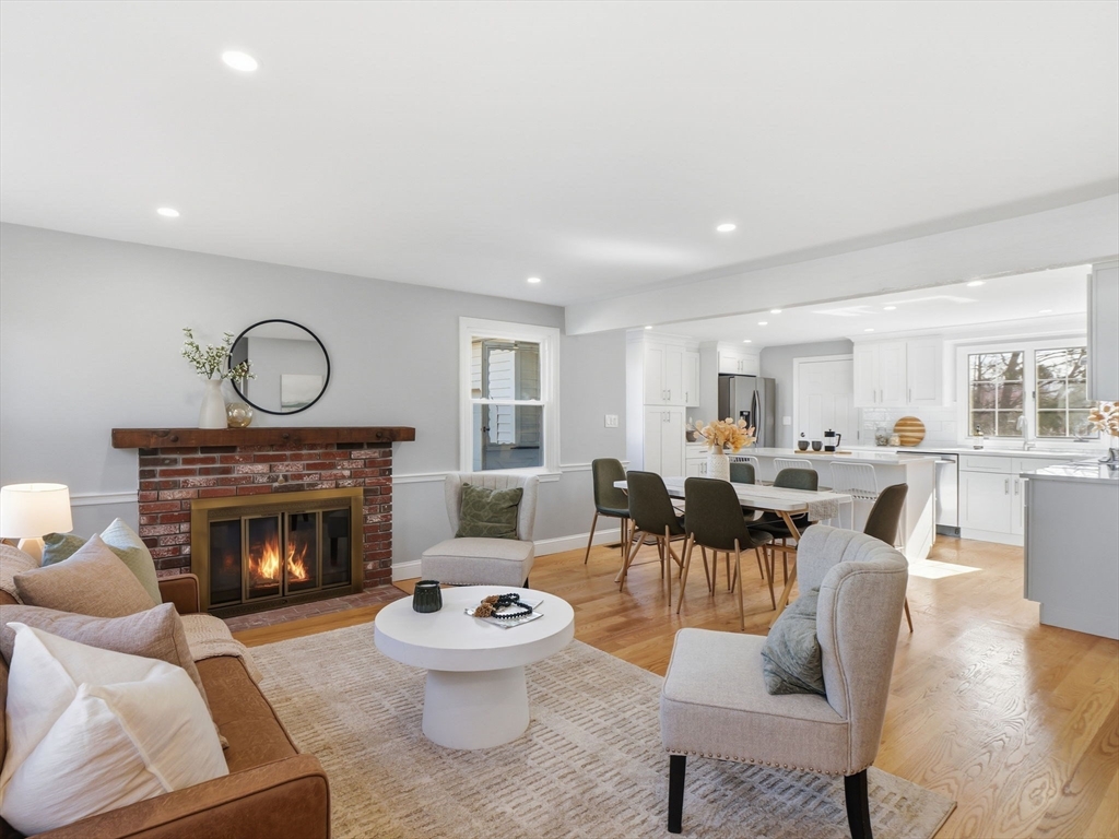 58 Maple Street Framingham, MA 01702 - Photo 2 of 35 a living room with furniture a fireplace and a fireplace
