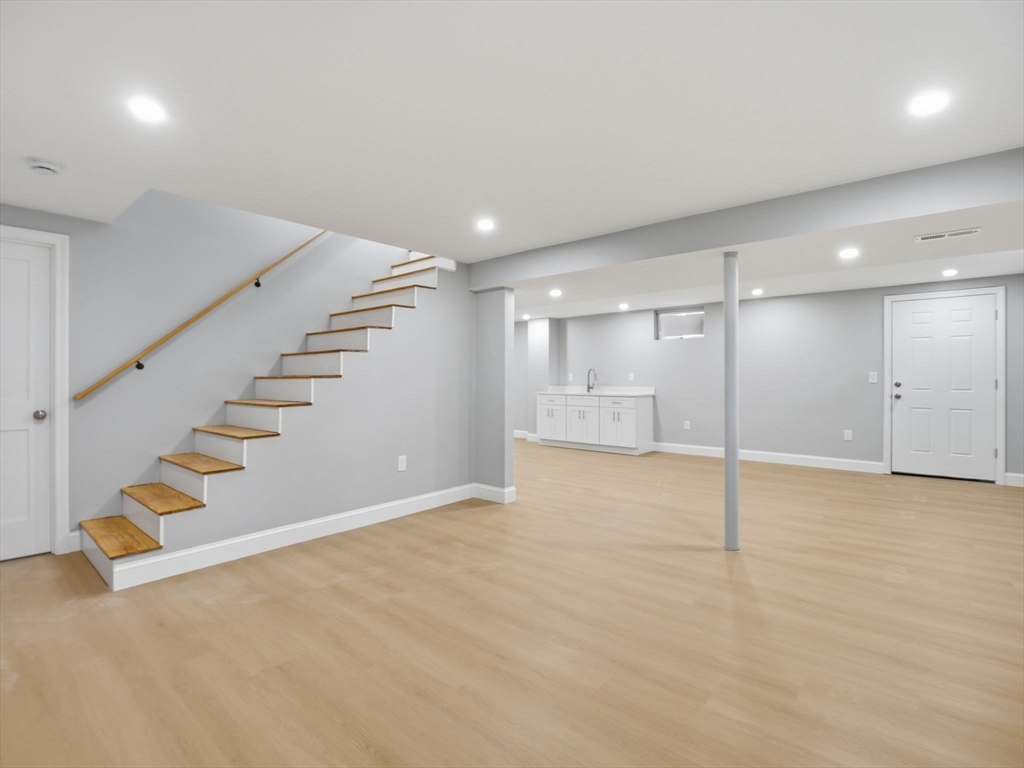 58 Maple Street Framingham, MA 01702 - Photo 24 of 35 a view of an empty room with wooden floor