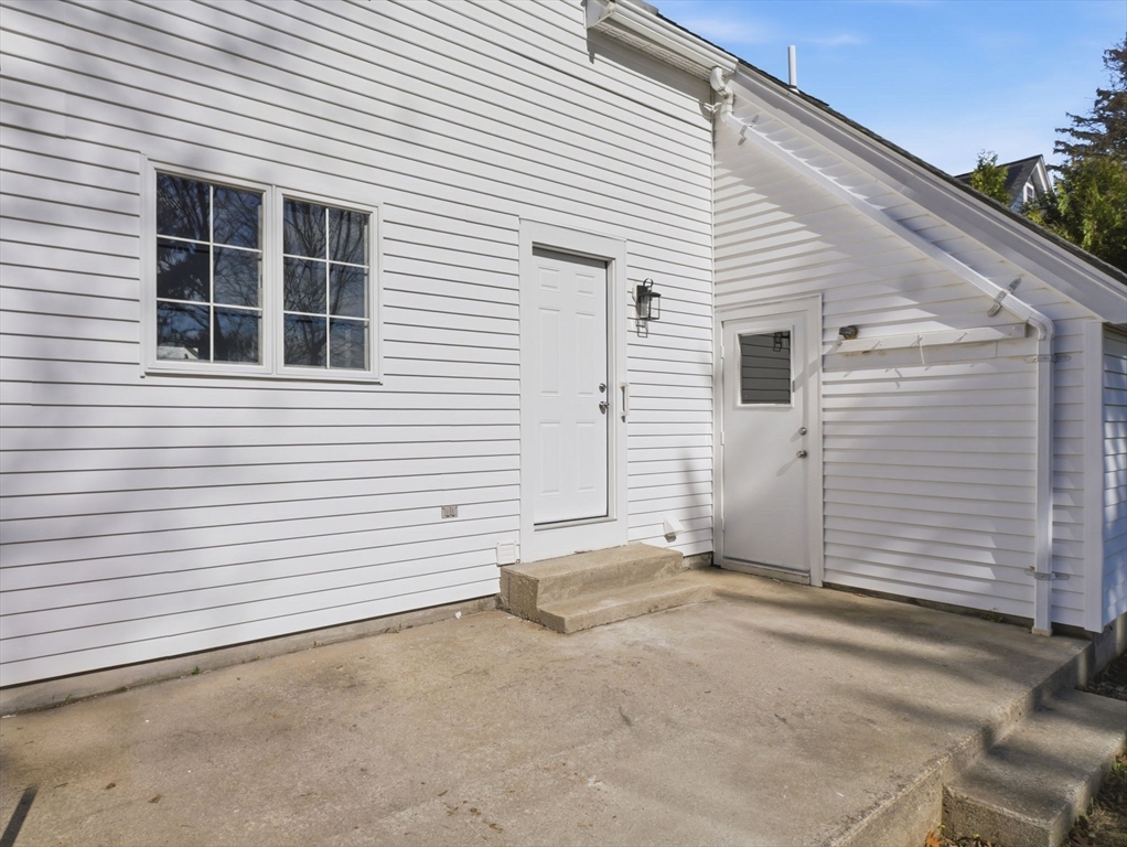 58 Maple Street Framingham, MA 01702 - Photo 31 of 35 a view of a house with white door