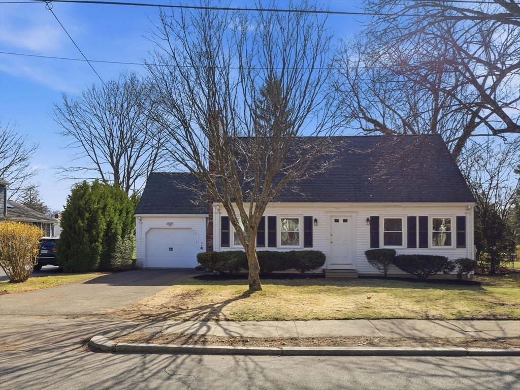 58 Maple Street Framingham, MA 01702 - Photo 34 of 35 a view of a white house with a small yard and large tree