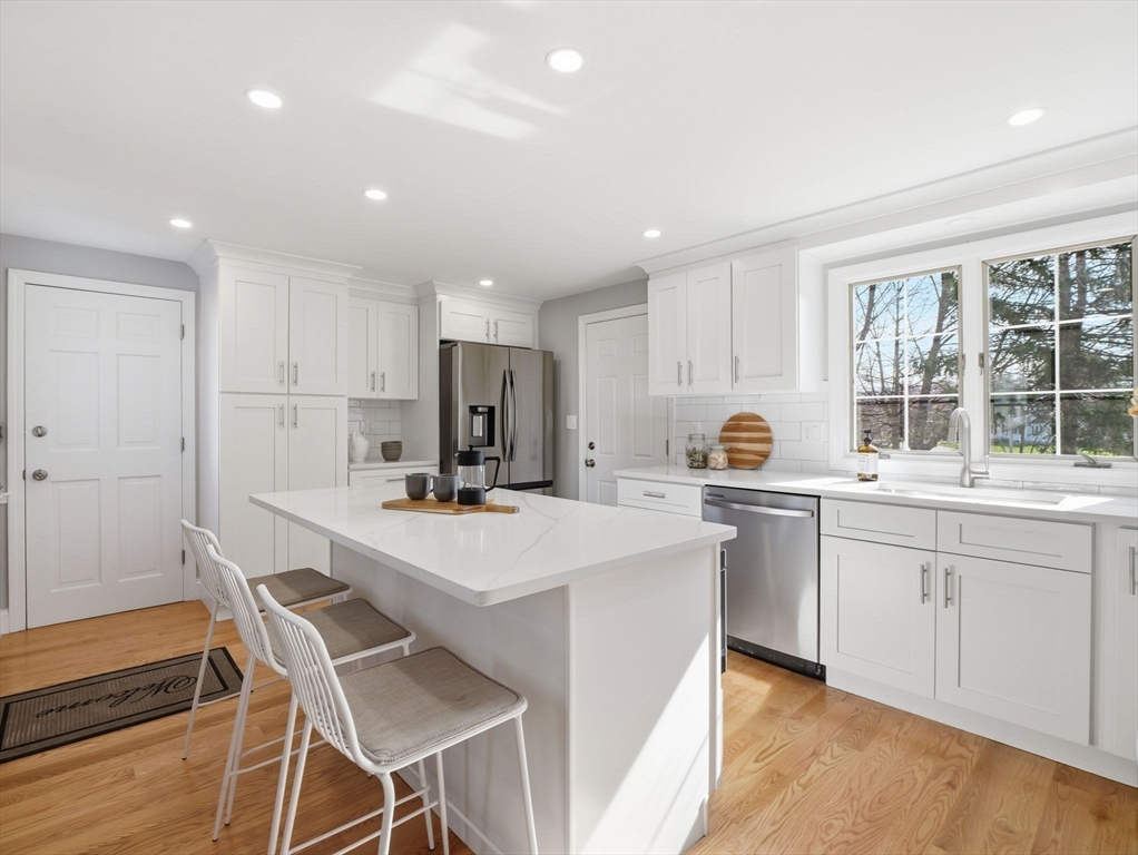 58 Maple Street Framingham, MA 01702 - Photo 5 of 35 a kitchen with appliances a sink and cabinets
