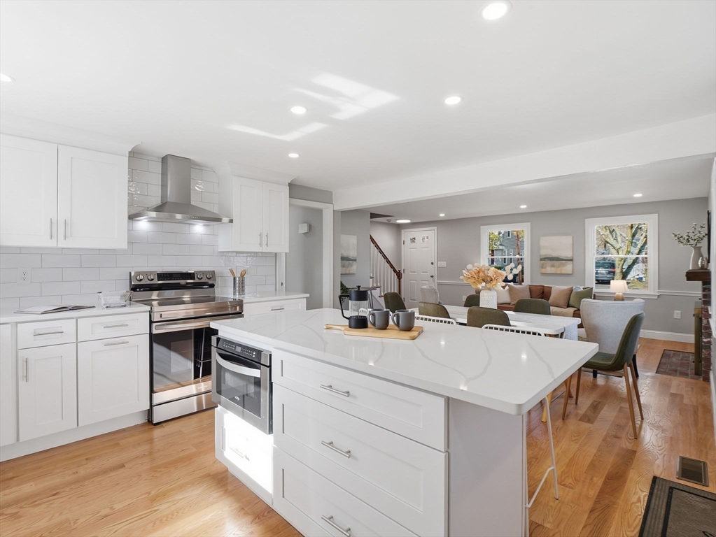 58 Maple Street Framingham, MA 01702 - Photo 7 of 35 a view of kitchen with sink microwave and stove