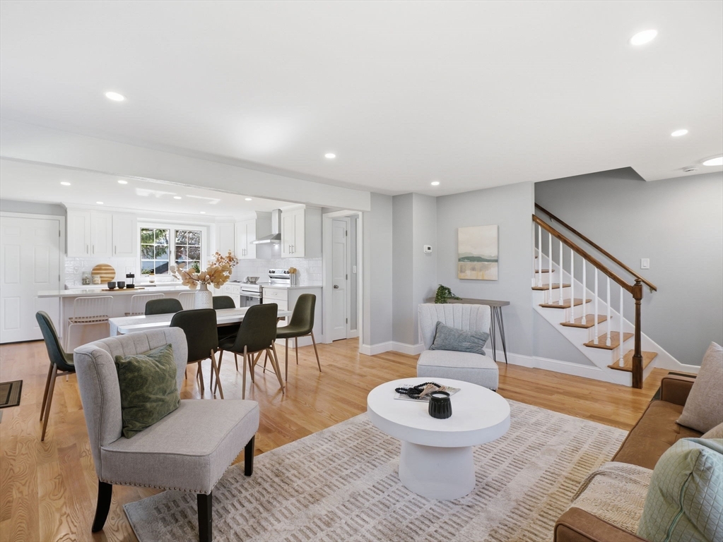 58 Maple Street Framingham, MA 01702 - Photo 10 of 35 a living room with furniture a table and kitchen view