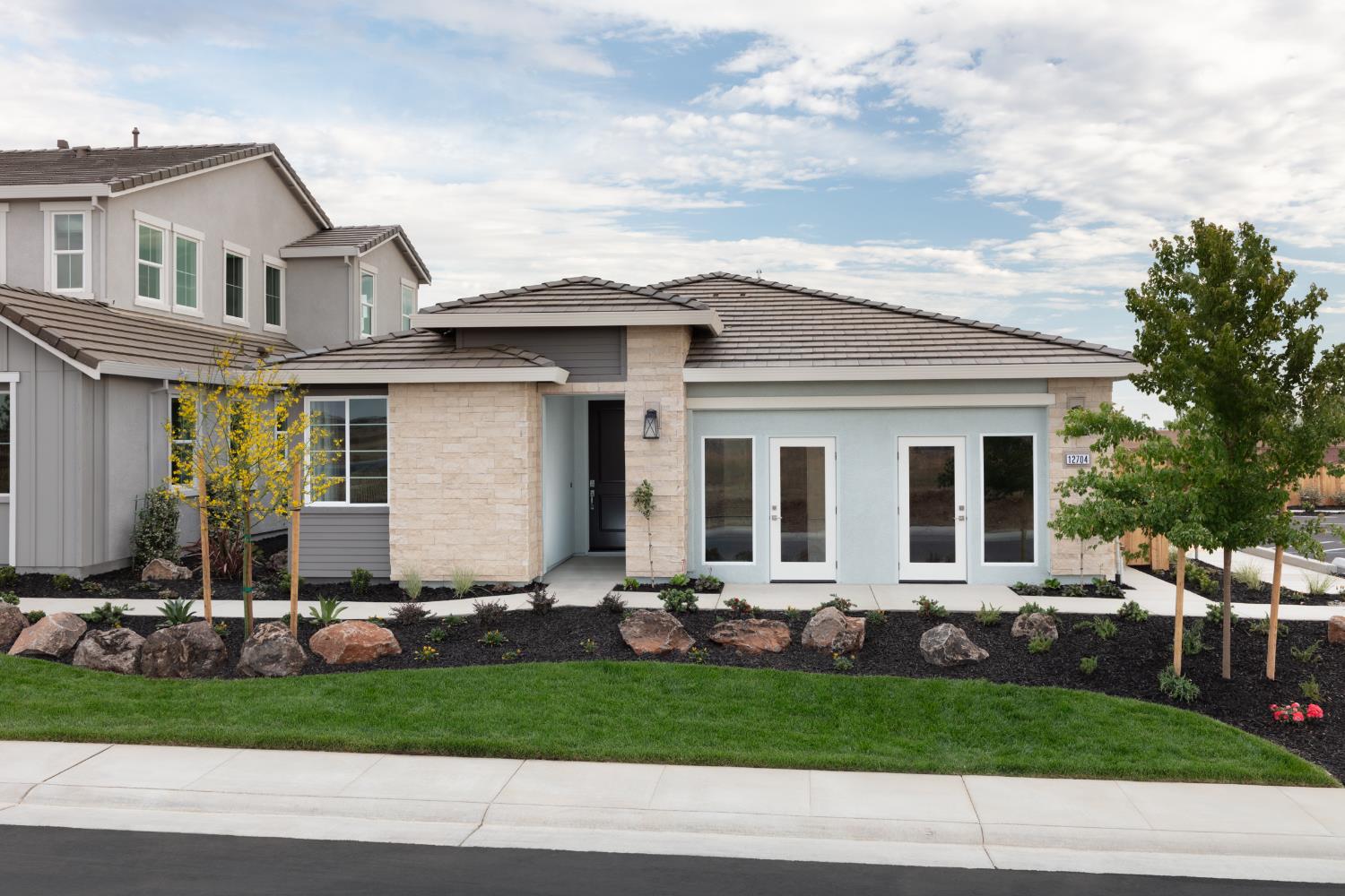 12704 Castaic Lk Way Rancho Cordova, CA 95742 - Photo 1 of 13 a front view of a house with a yard and outdoor seating