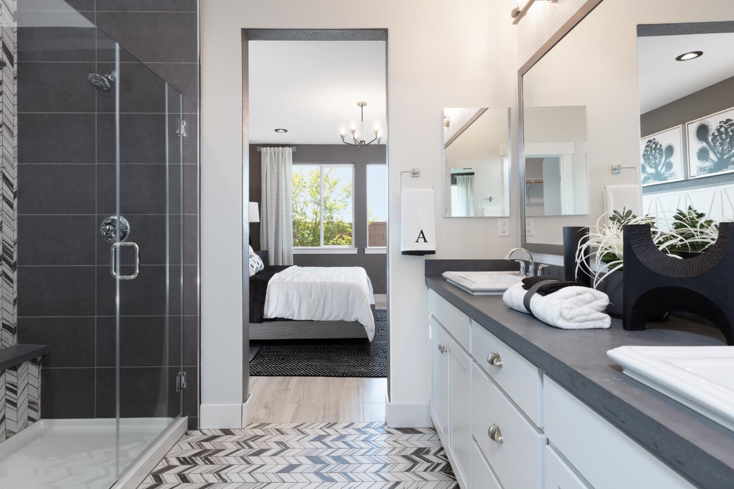 12704 Castaic Lk Way Rancho Cordova, CA 95742 - Photo 11 of 13 a en suite bathroom with a double vanity sink a mirror and shower