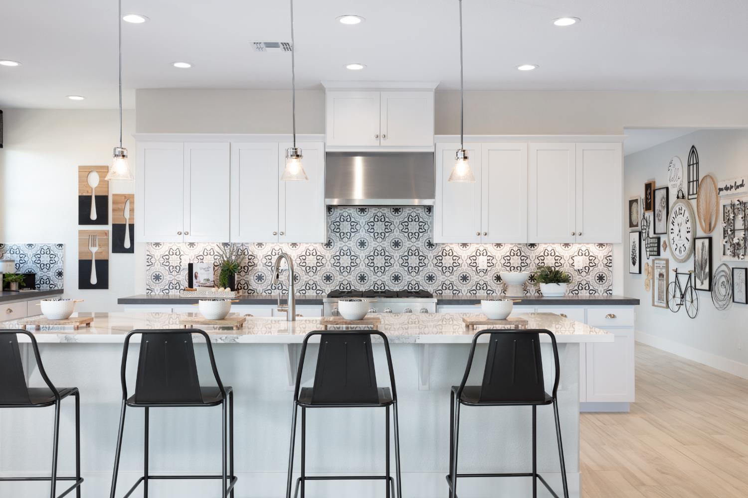 12704 Castaic Lk Way Rancho Cordova, CA 95742 - Photo 5 of 13 a kitchen with stainless steel appliances kitchen island granite countertop a sink and cabinets