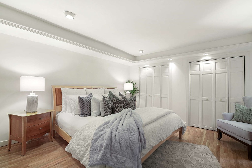 5 Durham Street, Unit 2 Boston, MA 02115 - Photo 16 of 22 a bedroom with a bed and lamp