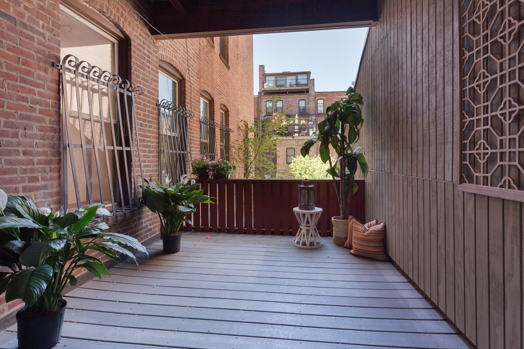 5 Durham Street, Unit 2 Boston, MA 02115 - Photo 19 of 22 a view of a balcony with potted plants