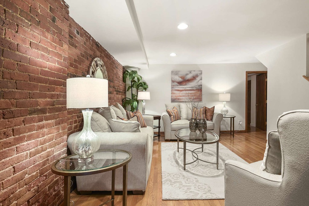 5 Durham Street, Unit 2 Boston, MA 02115 - Photo 8 of 22 a living room with furniture and a table