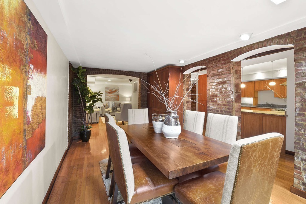 5 Durham Street, Unit 2 Boston, MA 02115 - Photo 9 of 22 a dining room with furniture and wooden floor
