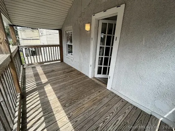 an entryway with wooden floor