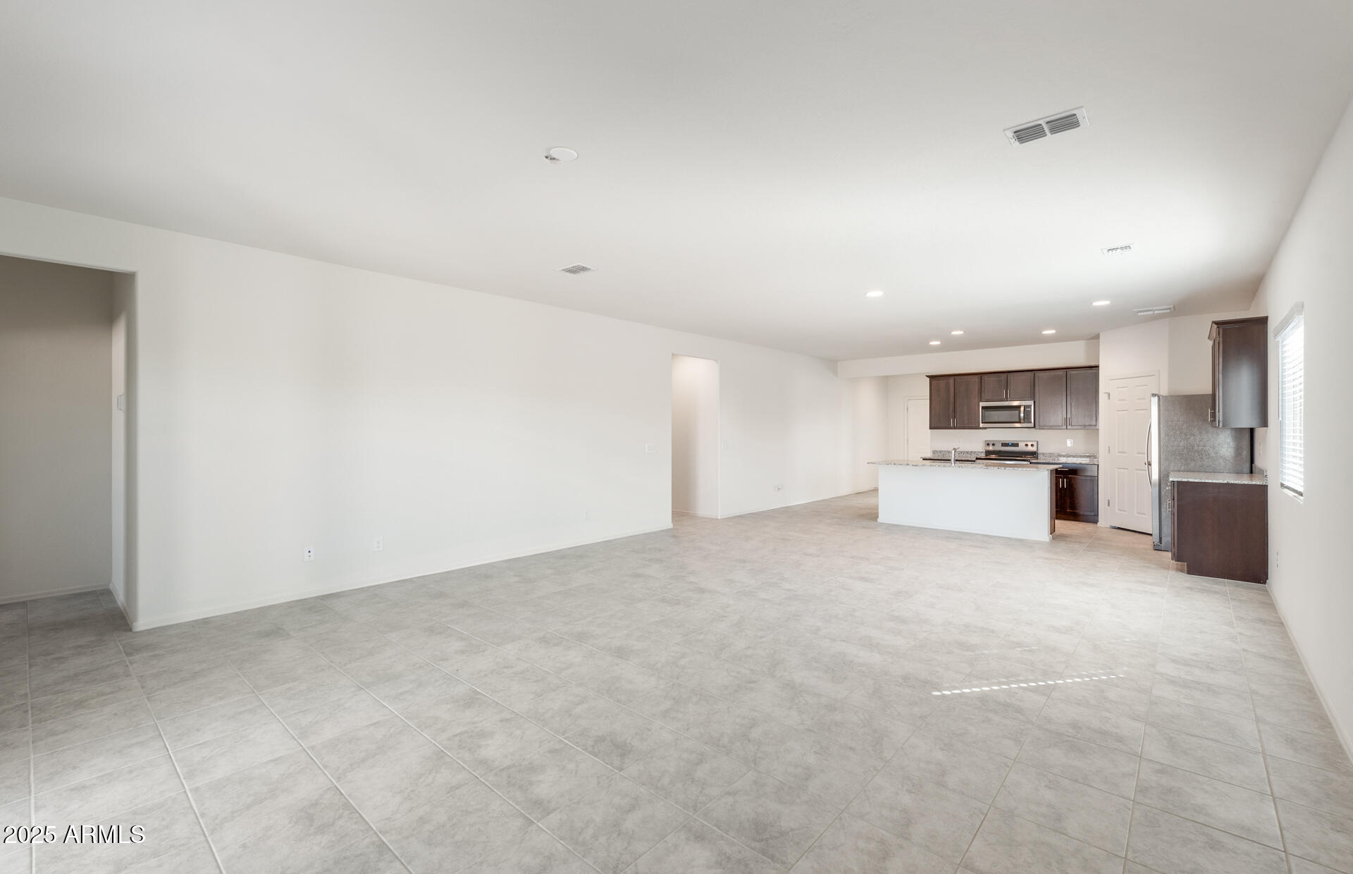 25468 West Chipman Road Buckeye, AZ 85326 - Photo 8 of 19 7 - Gathering Room and Kitchen