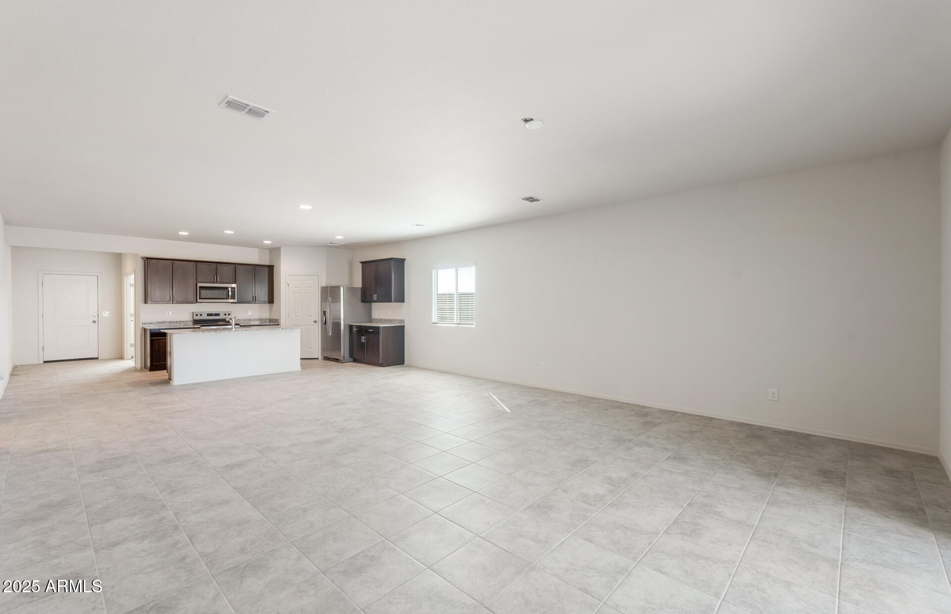 25468 West Chipman Road Buckeye, AZ 85326 - Photo 9 of 19 8 - Gathering Room and Kitchen