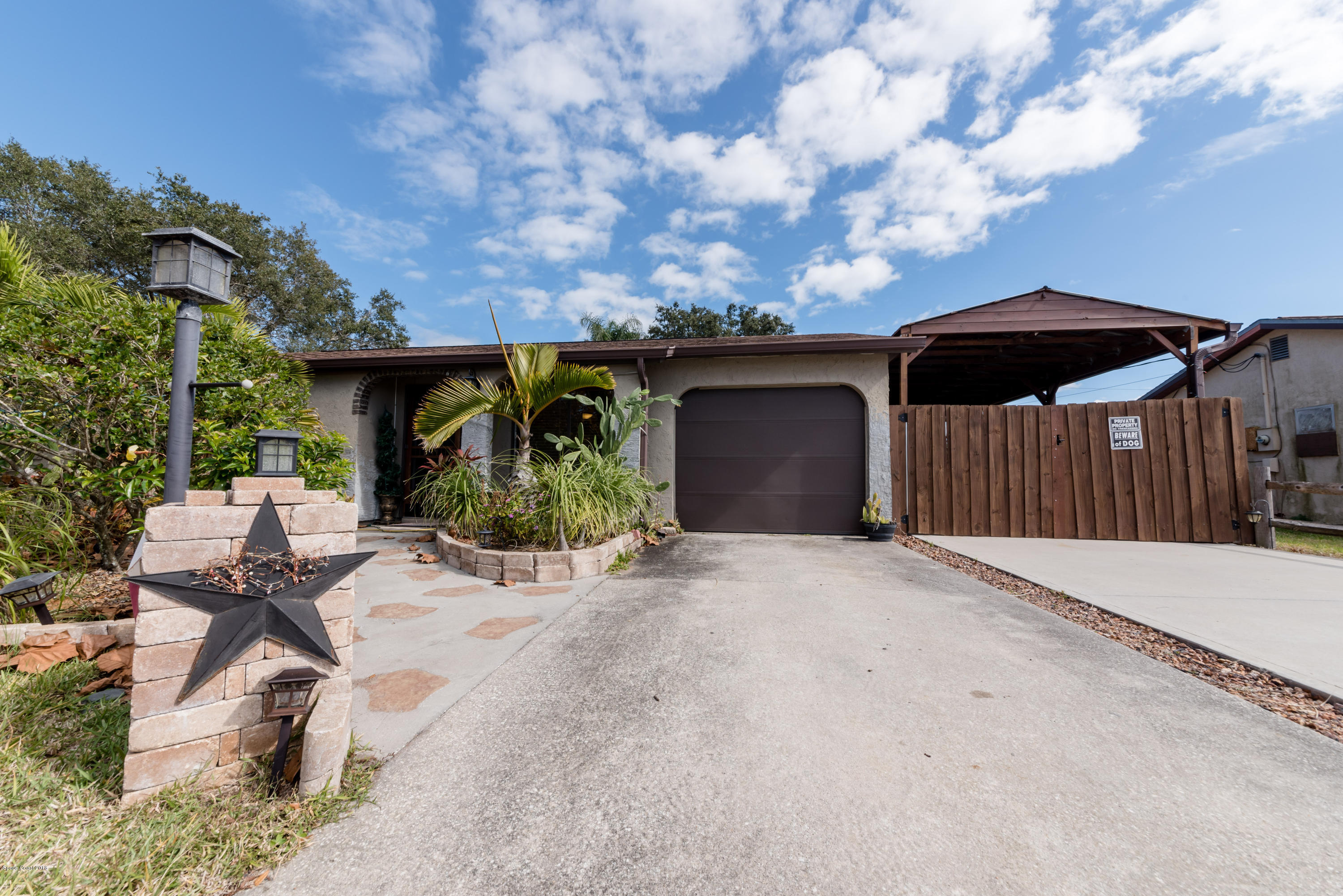 253 Chase Road Cocoa, FL 32927 - Photo 1 of 22 a front view of a house with garden