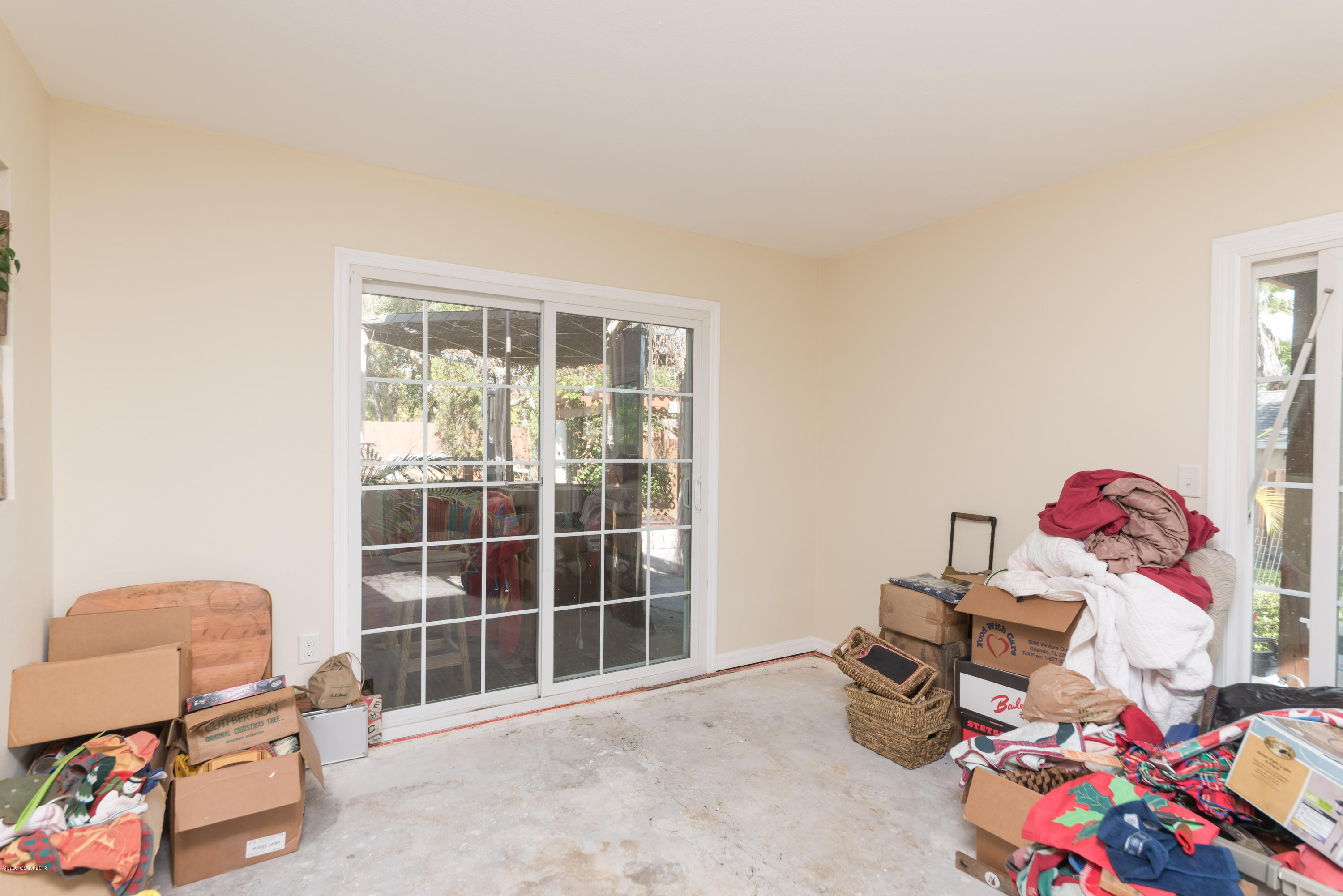 253 Chase Road Cocoa, FL 32927 - Photo 16 of 22 a bedroom with furniture and a window