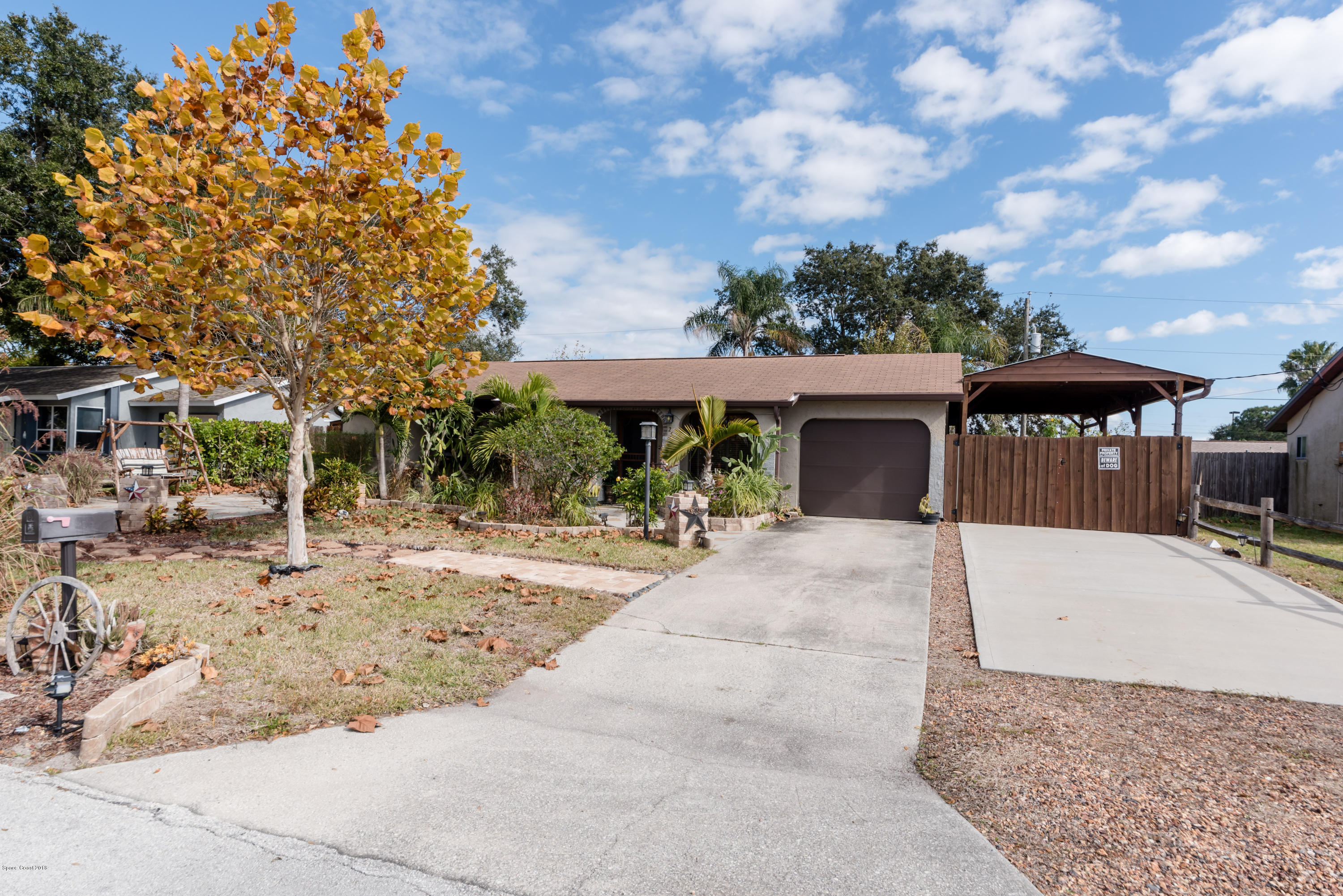 253 Chase Road Cocoa, FL 32927 - Photo 3 of 22 a front view of a house with a garden