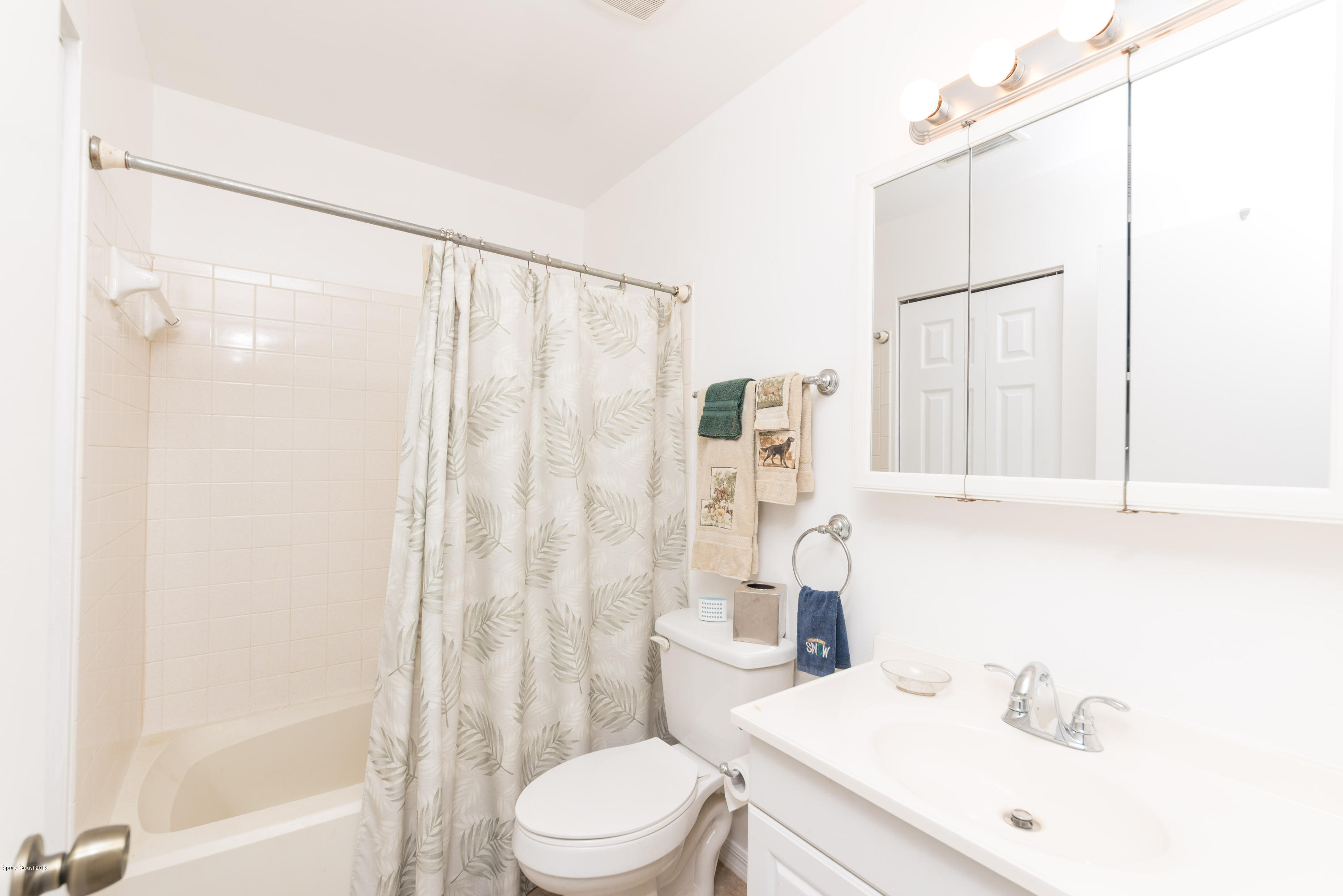 253 Chase Road Cocoa, FL 32927 - Photo 22 of 22 a bathroom with a sink a toilet and shower