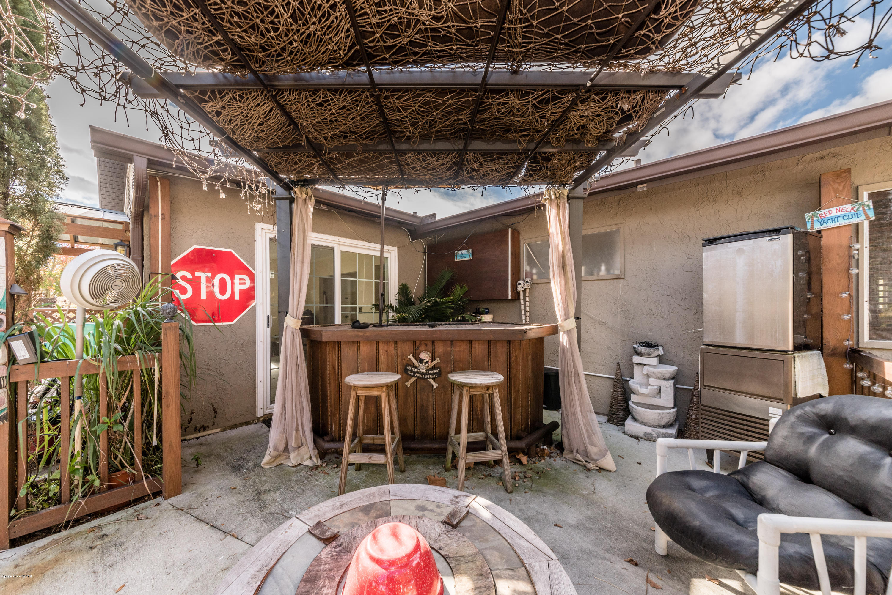 253 Chase Road Cocoa, FL 32927 - Photo 8 of 22 a view of a chairs in patio
