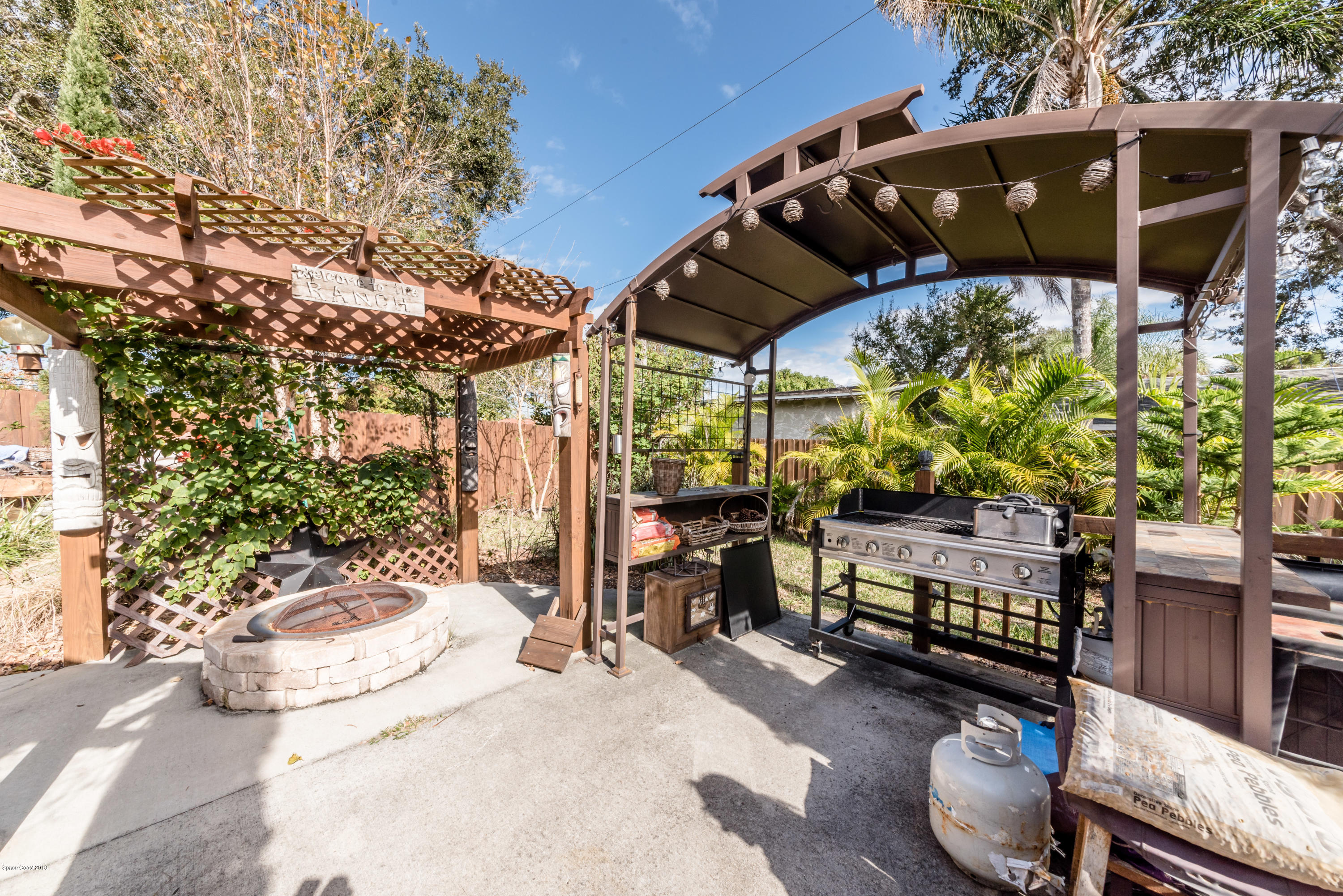 253 Chase Road Cocoa, FL 32927 - Photo 9 of 22 a view of a chairs and table in backyard
