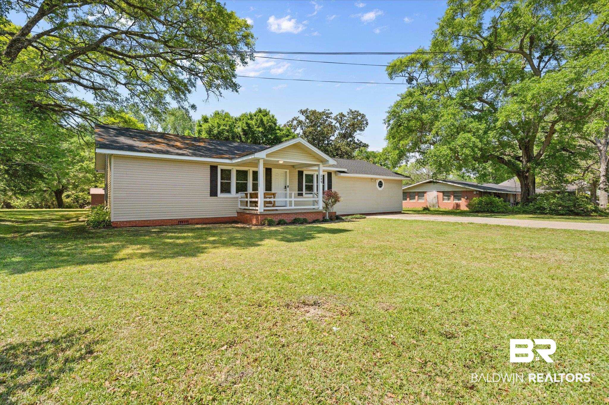 529 Cleveland Road Saraland, AL 36571 - Photo 28 of 31 Single story home with a front yard, crawl space, covered porch, and driveway