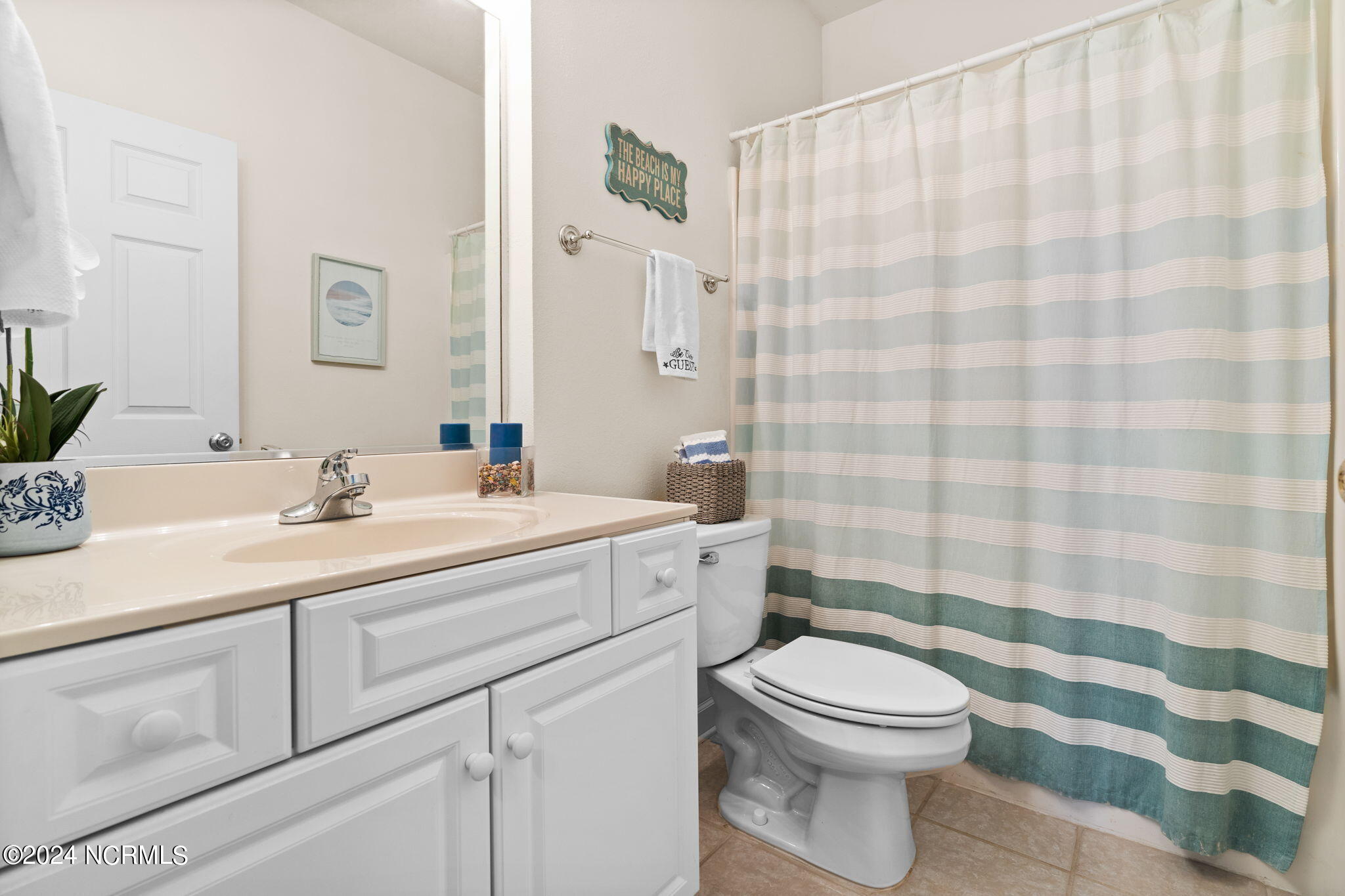 182 Clubhouse Road, Unit 1 Sunset Beach, NC 28468 - Photo 21 of 52 Guest bathroom is located directly across from the 3rd bedroom.