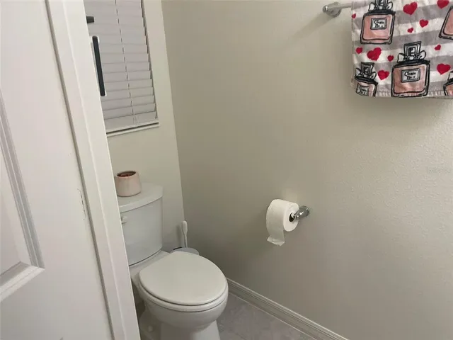a living room filled with furniture and a chandelier